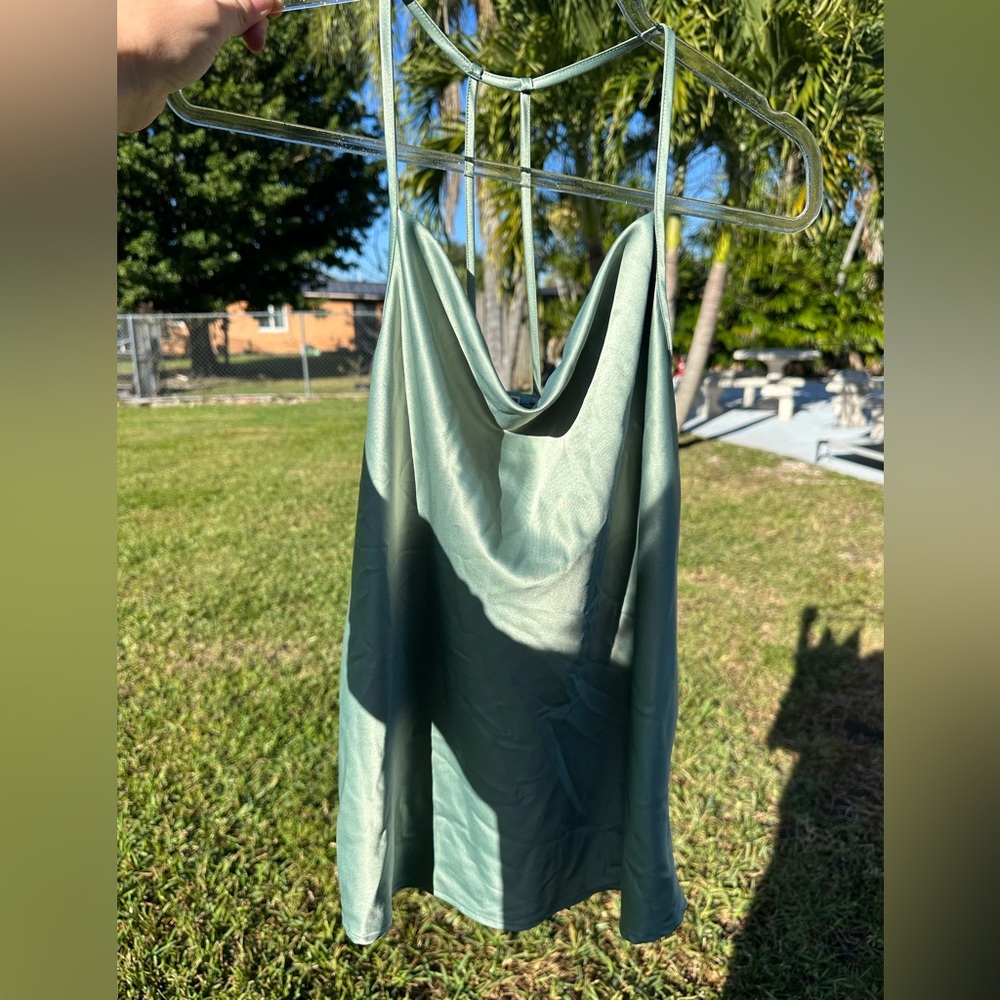 Satin like well made green blouse from Pleione